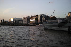 battleship, city, city, cityscape, England, evening, eye level view, London, natural light, river, sunset, The United Kingdom, waterfront, winter
