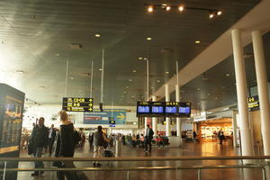 airport, artificial lighting, Copenhagen , crowd, Denmark, display, dusk, eye level view, interior, Kobenhavn, people, sign, spring