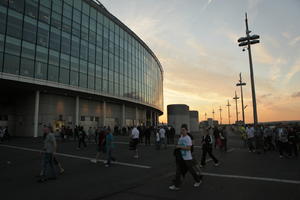 boy, crowd, dusk, England, eye level view, facade, glass, London, people, stadium, The United Kingdom, walking