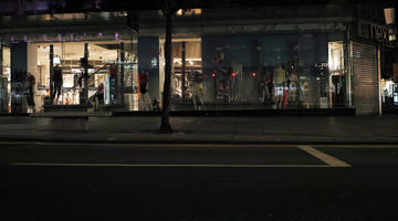 artificial lighting, England, eye level view, London, night, outdoor lighting, retail, shop, street, The United Kingdom
