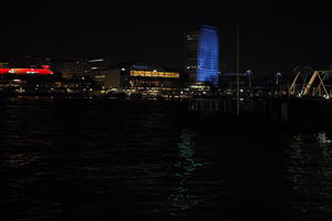 artificial lighting, city, city, city lights, cityscape, England, eye level view, London, night, quay, river, riverbank, spring, The United Kingdom, tower, urban